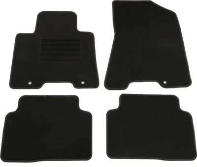 A set of four black car floor mats on a white background.