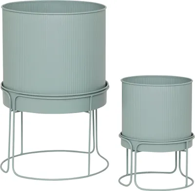 Two ribbed cylindrical planters on stands, one larger than the other, are shown against a white background.