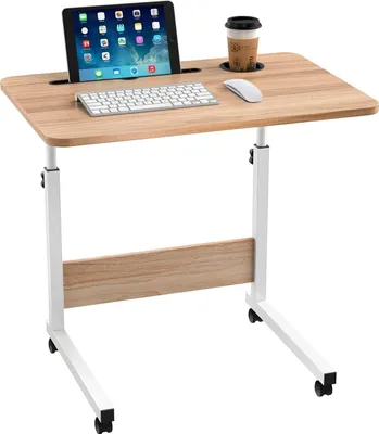 A mobile laptop table with a tablet, keyboard, mouse, and a cup of coffee on it, set against a white background.
