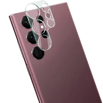 A clear glass camera lens protector is shown on the back of a purple smartphone.