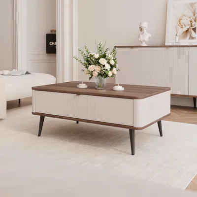 A modern living room setting with a coffee table as the main focus.