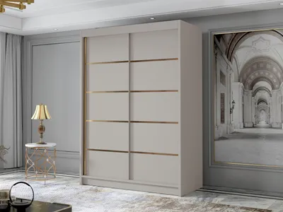 A modern bedroom or living room setting with a large sliding door wardrobe, a side table with a lamp, and a large framed artwork on the wall.