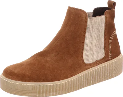 A single brown suede Chelsea boot with a beige elasticated side panel and a thick, textured sole, presented against a plain white background.