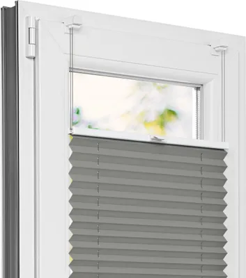 A close-up view of a gray pleated blind installed in a white window frame.