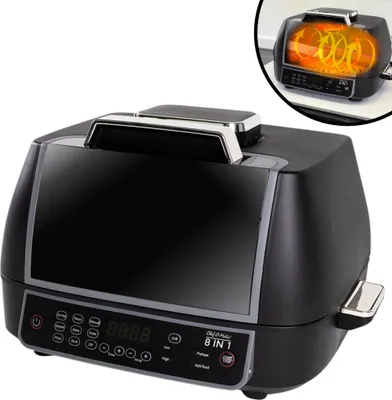A black Chef O Matic 8 in 1 Air & Grill multi-cooker is shown from a front-side angle against a white background. A smaller inset image shows the interior of the appliance with glowing heating elements.