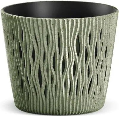 A close-up studio shot of a green plant pot with a textured, wavy design.