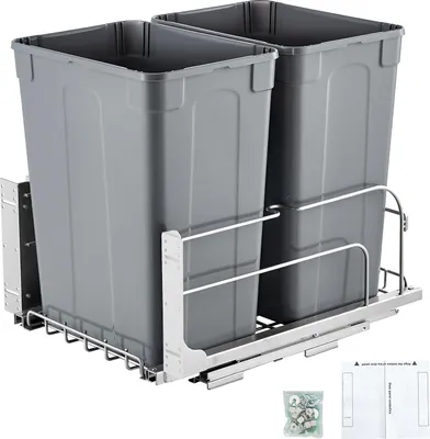 A pull-out trash can system with two gray bins mounted on a metal sliding frame, shown from a diagonal angle.