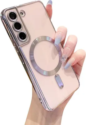 A hand holding a clear phone case with a magnetic ring on the back.