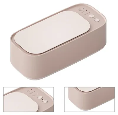 A beige ultrasonic cleaner with a cream-colored lid and control buttons.