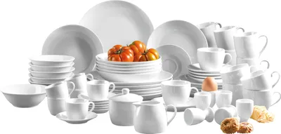 A collection of white ceramic dishes and cups arranged on a white background.