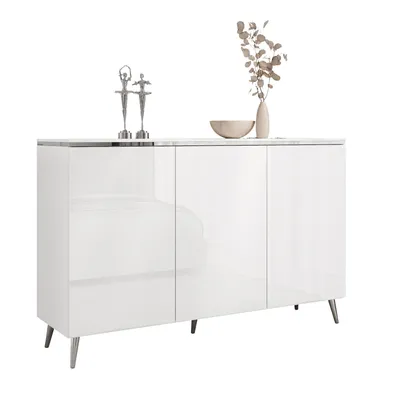 A white sideboard with silver legs and decorative items on top.