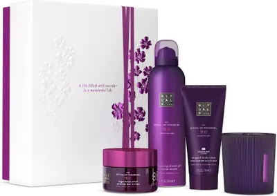 A gift set of Rituals Yozakura products, including a gift box, shower gel, body scrub, body cream, and a candle.