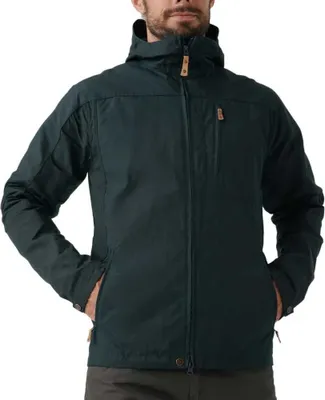 A man wearing a dark blue Fjällräven outdoor jacket.