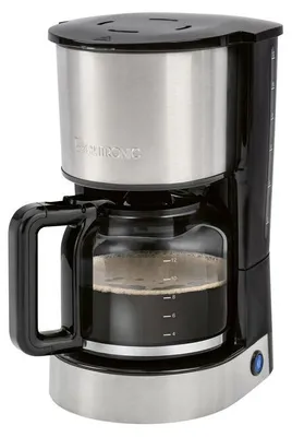 A close-up studio shot of a black and silver drip coffee maker filled with coffee.