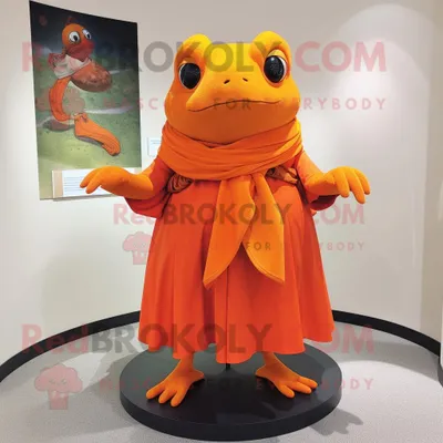 Produktbild von Orangefarbener REDBROKOLY Frosch Maskottchen Kostüm charakter bekleidet mit einem Wickelkleid und Schalnadeln