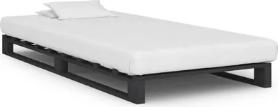 A simple bed frame with a mattress and pillow on a white background.