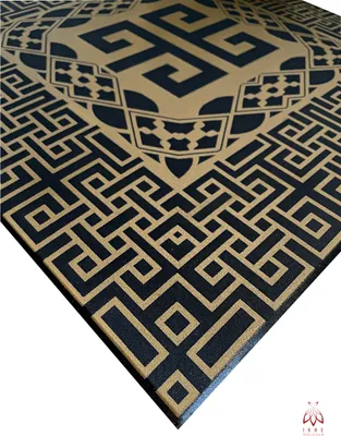 A close-up, angled view of a decorative wall panel with a geometric pattern.