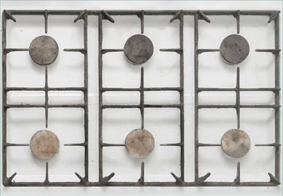 Produktbild von Wallario Fototapete Vliestapete, seidenmatte Oberfläche, einfache Verarbeitung, Größe 200 x 140 cm, Motiv Alter Gasherd, ungeputzt und dreckig