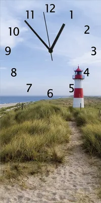Produktbild von Wallario Design Wanduhr bedruckt, Größe 30 x 60 cm, Motiv: Am Strand von Sylt  Leuchtturm auf der Düne  Panorama