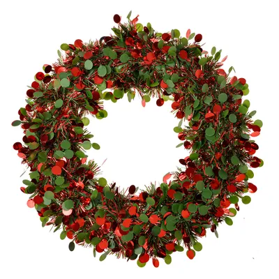 A Christmas wreath made of tinsel and confetti in red and green.