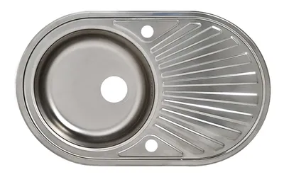 A top-down view of a stainless steel kitchen sink with a drainboard.