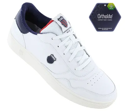 A white K-Swiss sneaker with blue and red accents, shown from a slightly elevated side angle against a white background. A hexagonal tag with 'Ortholite' branding is visible in the upper right corner.