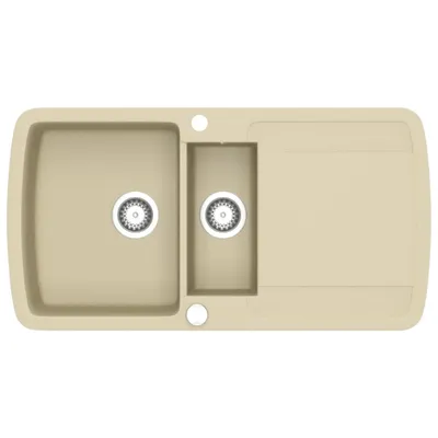 A top-down view of a beige granite kitchen sink with a double basin and a drainboard.