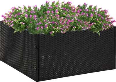 A black rattan planter filled with purple flowers against a white background.