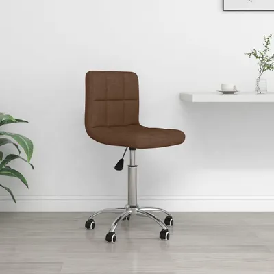 A brown fabric office chair with a silver base and wheels, shown in a room with a white wall and light wooden floor.