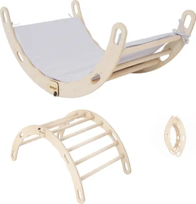 A set of wooden climbing toys for children, including a rocking arch with a cushion and a climbing triangle.