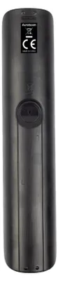 The back of a black remote control with labels and a circular indentation.