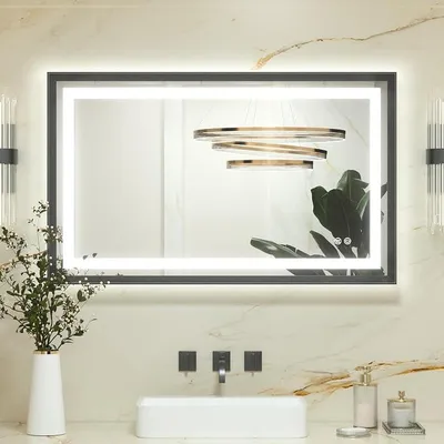 Imagen del producto de Espejo de baño con iluminación, marco de metal , 100x60 cm. Espejo de baño iluminado con tecnología antiniebla, luz LED y interruptor táctil. Ofrece 3 colores de luz regulables y función de memoria. Espejo de pared