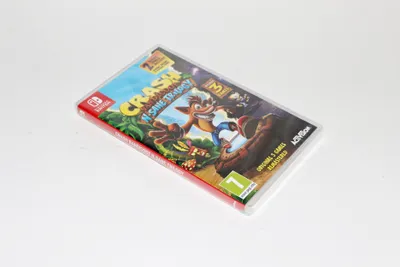 A video game case for Crash Bandicoot N. Sane Trilogy is shown on a white background.