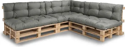 A sectional sofa made from wooden pallets with gray cushions.