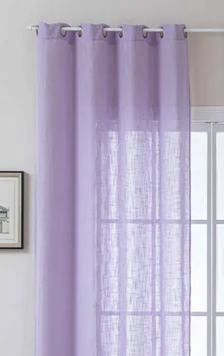 A close-up view of a light purple sheer curtain hanging in front of a window.