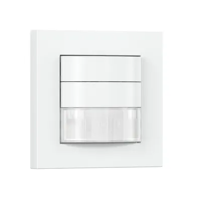 A white motion sensor mounted on a white wall.