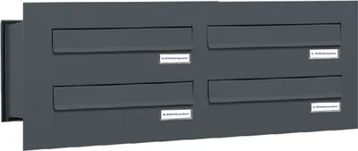 A dark gray, four-unit mailbox system mounted on a wall.