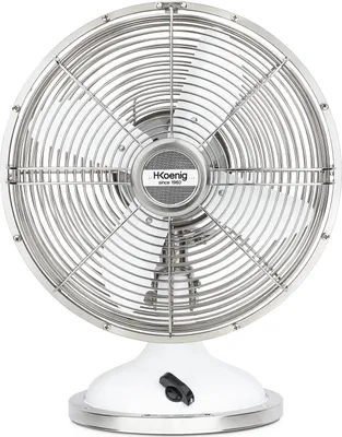 A close-up, front-facing view of a silver and white desk fan with a retro design.