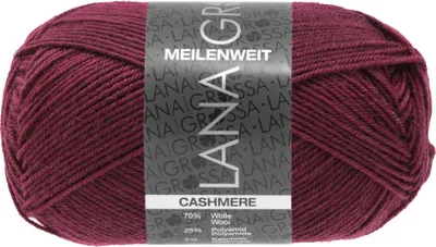 A ball of burgundy yarn with a label on it.