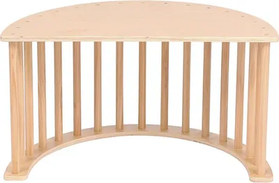 A wooden children's rocker on a white background.