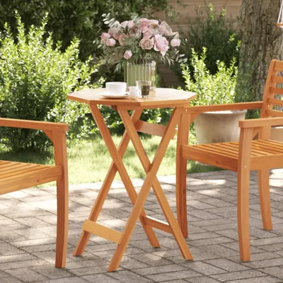 An outdoor patio setting with a wooden table and chairs, a vase of flowers, and a cup of coffee.