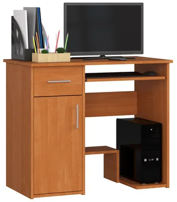 A computer desk with a monitor, keyboard, computer tower, and storage.