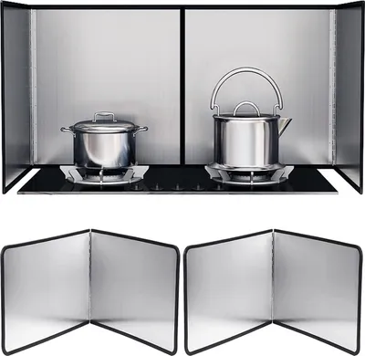 A kitchen stove with pots and a kettle, protected by splash guards.