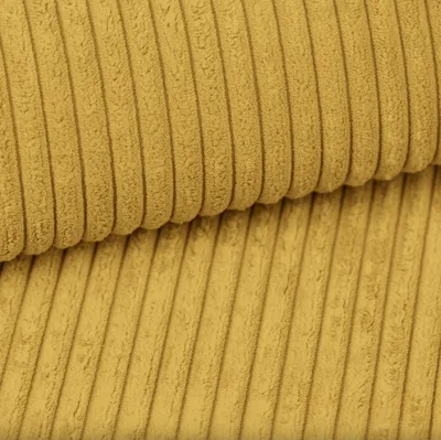 Close-up view of yellow corduroy fabric.