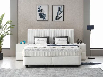 A bedroom setting with a bed as the main focus.