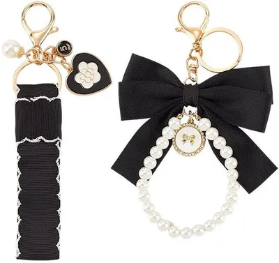 Immagine prodotto di Portachiavi nero con perline e punte - con pomello girevole - Accessorio da viaggio alla moda