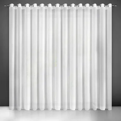A white sheer curtain hanging from a curtain rod against a dark gray wall.