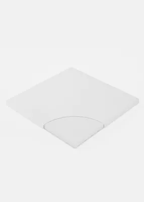 A white mattress for a playpen is shown from a diagonal angle on a white background.