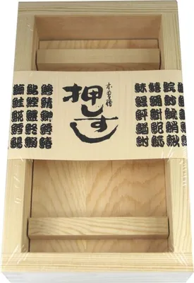 A wooden sushi maker mold on a white background.