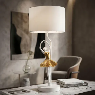 Zdjęcie produktu dla Lampa stołowa baletnica z żywicy, biała i złota ø 28x64 cm
